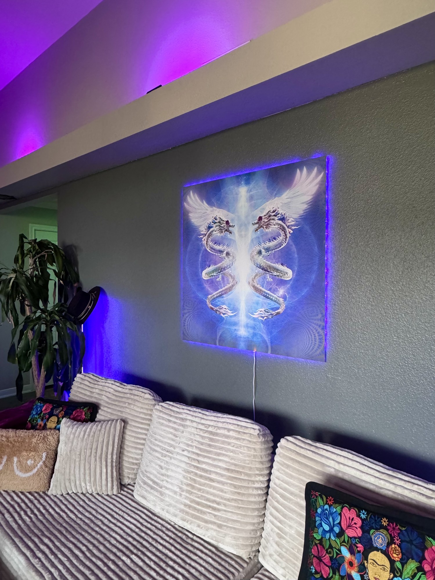 Alchemy: Prima Materia illuminated on a living-room wall, its own light washing the ceiling.