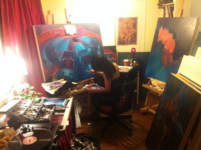 Leah Beth Flippen painting Portrait of Z at the easel in her studio