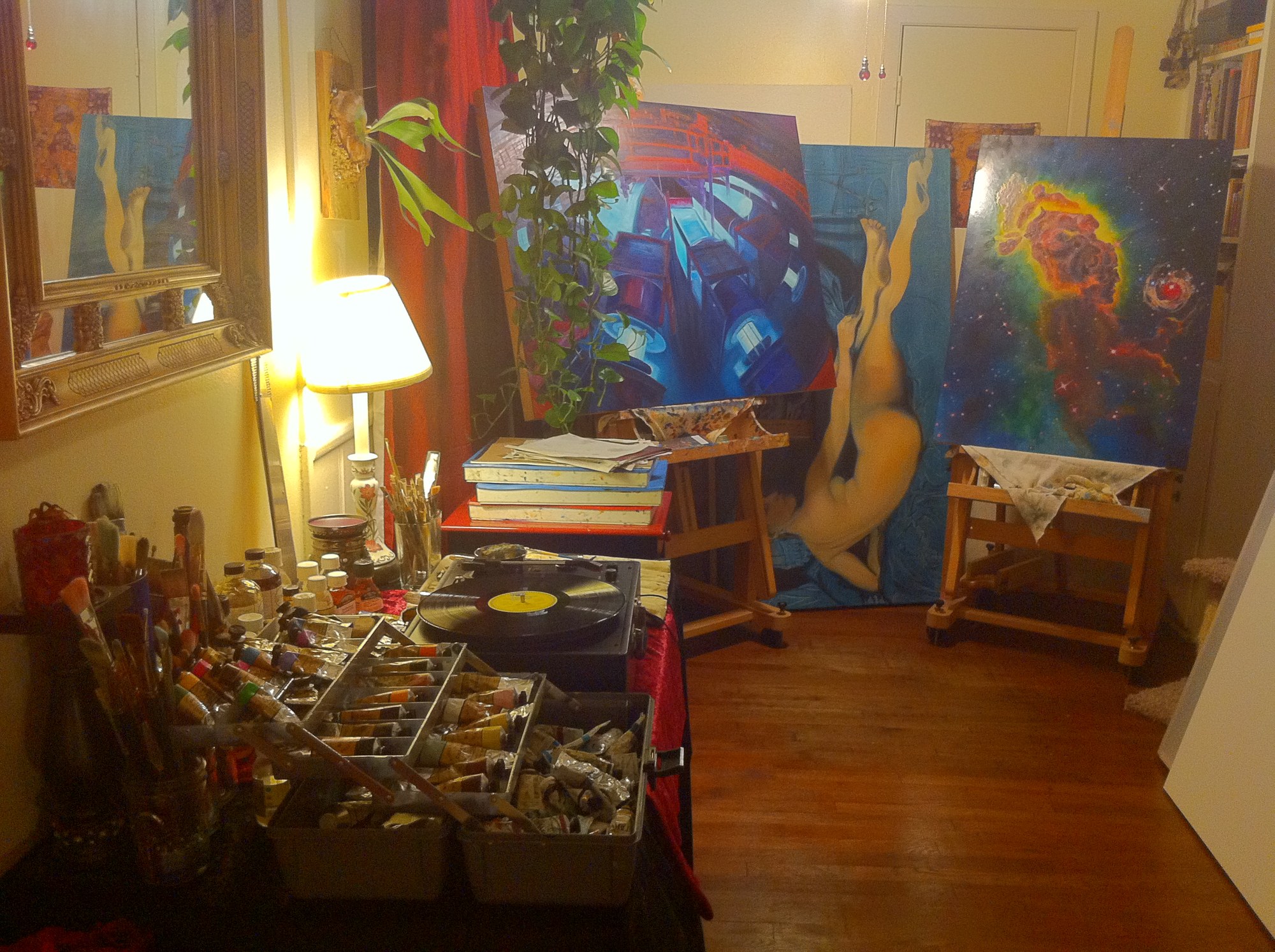 Prometheus’s Fire on the easel in the lamplit studio, beside the Z Machine painting and a wall of ranked oil paints.